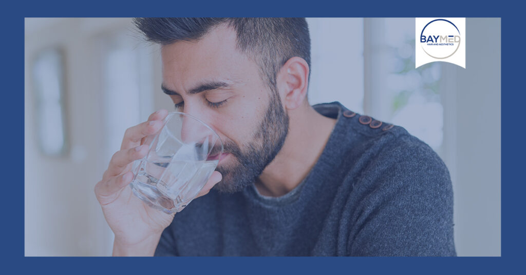 Man drinking glass of water