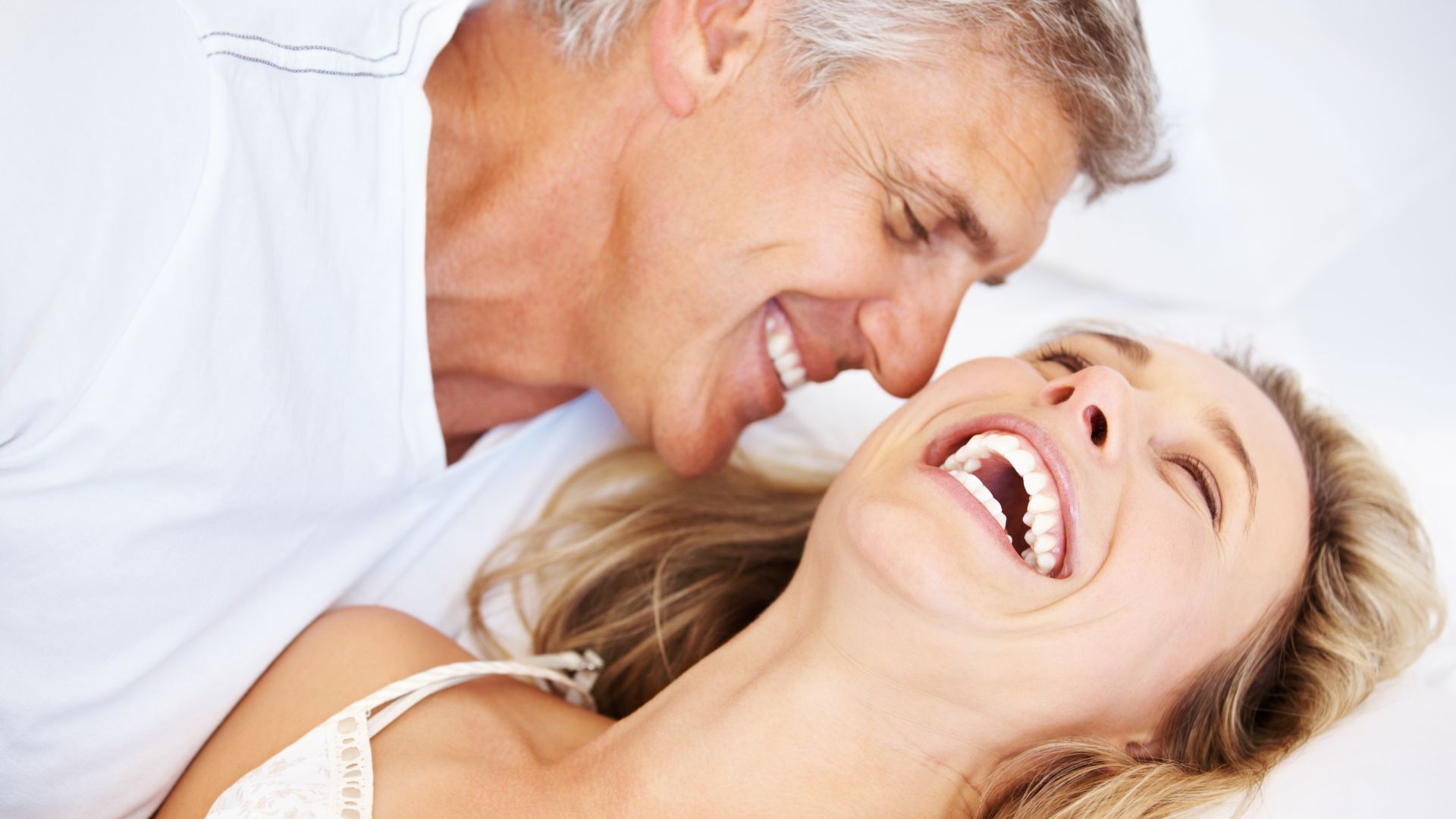 Happy couple laughing together, sexual wellness therapy at BayMed
