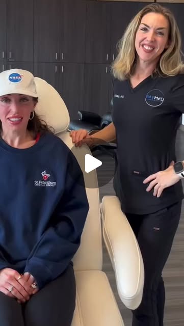 Julia O’Malley with a patient talking about NAD+ therapy at BayMed